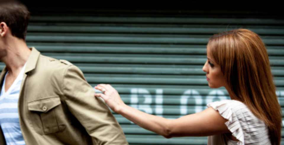 Sad woman reaching out to her boyfriend